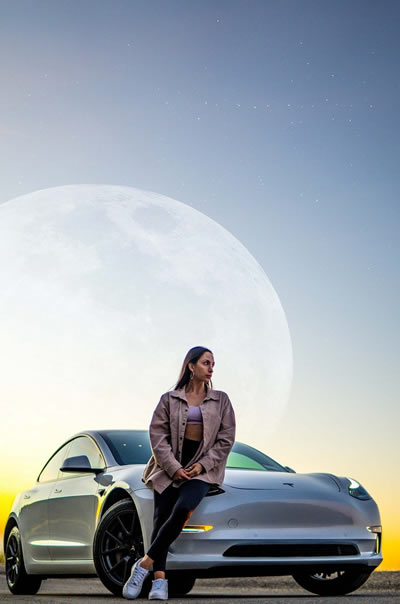 Tesla EV in the moon's glow.